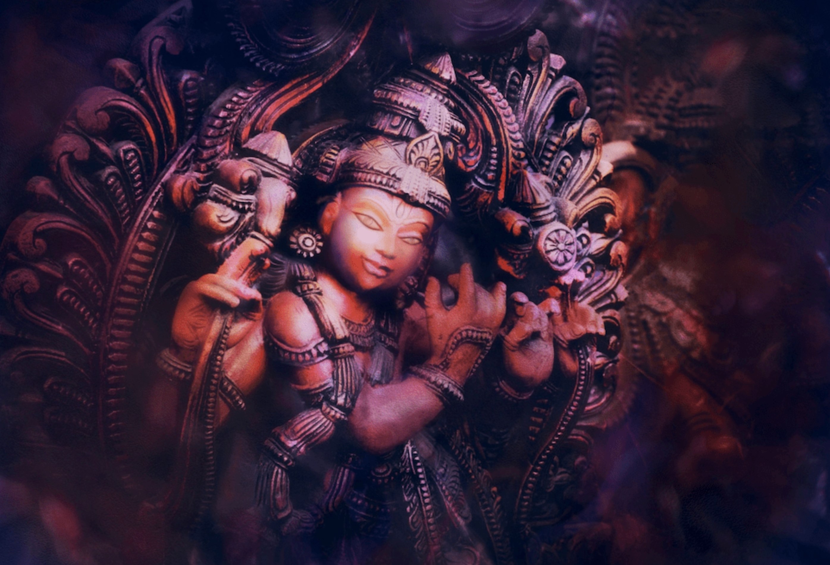 Watercolor painting of a carved Krishna statue playing the flute, emerging from deep violet shadow